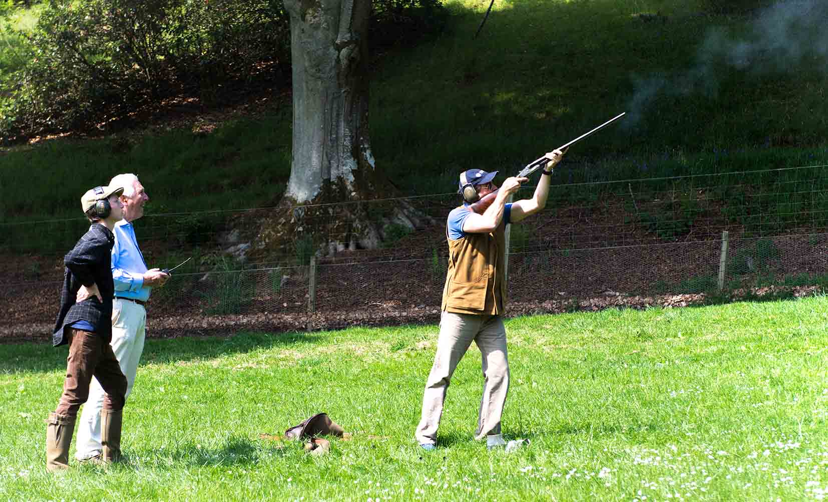 A colour image of Michael Campbell spectating clay pigeon shooting at the Edradynate shoot day in May 2017 -Edradynate Estate, Perthshire - Luxury Country House and Sporting Estate for Rent in Scotland
